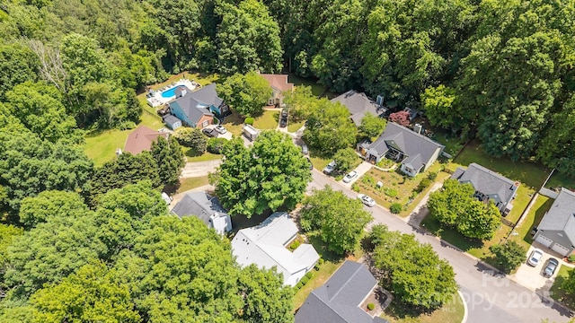 aerial view of residential area with a forest