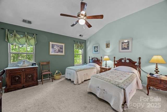 bedroom with multiple windows, carpet, vaulted ceiling, and ceiling fan