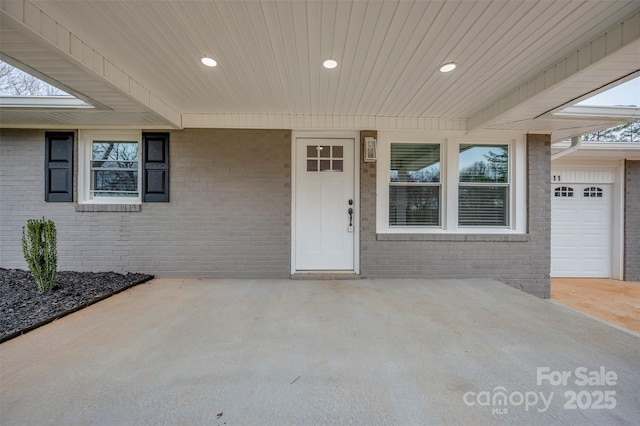 entrance to property with brick siding