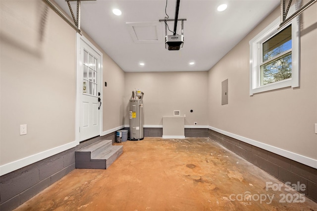 garage featuring recessed lighting, electric panel, a garage door opener, and water heater