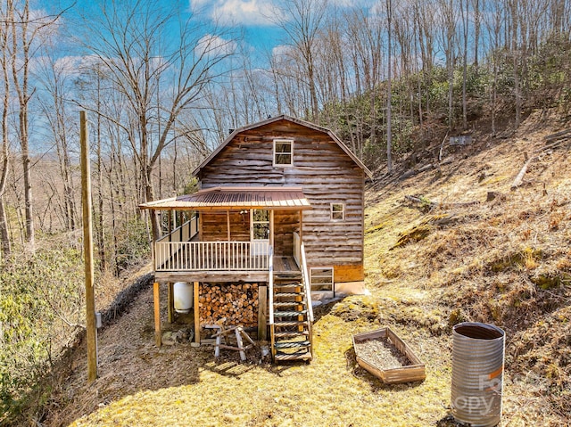 view of outbuilding with stairway