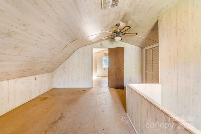 additional living space with visible vents, lofted ceiling, and ceiling fan