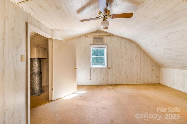 bonus room with lofted ceiling, wood ceiling, a ceiling fan, and visible vents