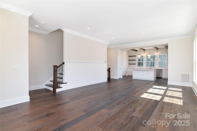 unfurnished living room featuring visible vents, dark wood-style flooring, crown molding, baseboards, and stairs