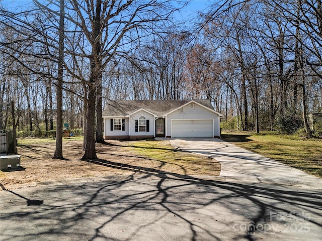 view of front facade featuring an attached garage and concrete driveway