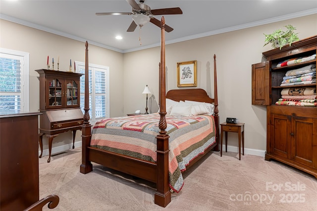 bedroom featuring baseboards, light carpet, multiple windows, and crown molding