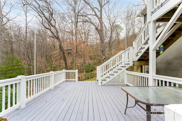 wooden terrace featuring stairs