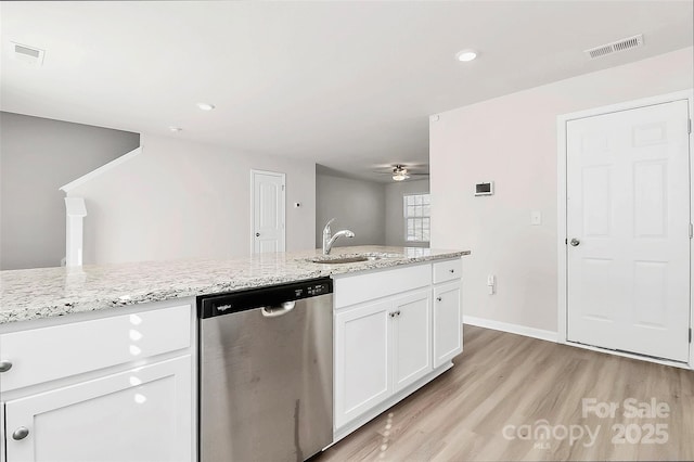 kitchen with visible vents, white cabinets, dishwasher, and light wood-style flooring