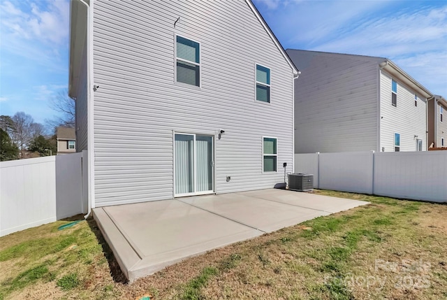 back of house with a yard, a patio, central AC unit, and a fenced backyard