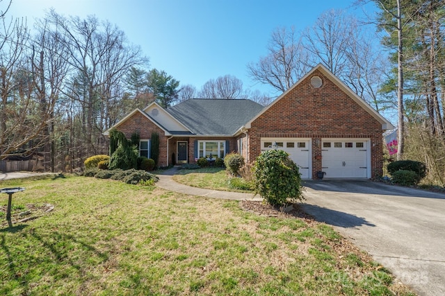 view of front facade featuring brick siding, driveway, a front yard, and a garage