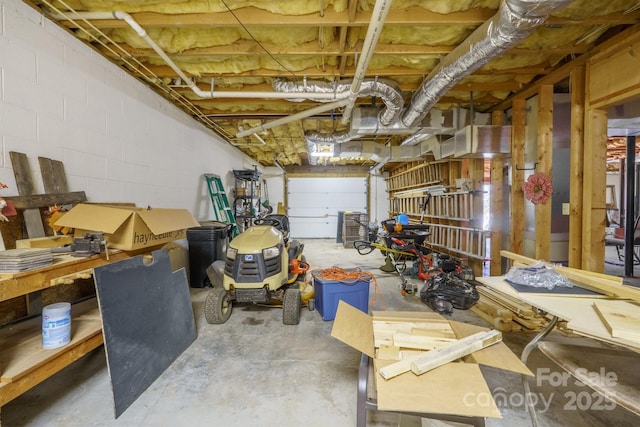 garage with concrete block wall