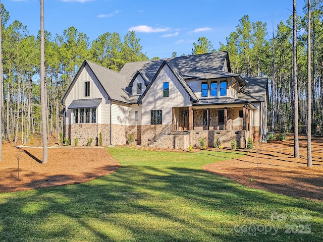 4354 Persimmon Rd, Lancaster, SC 29720 - view of front of property with stone siding, a front lawn, and covered porch