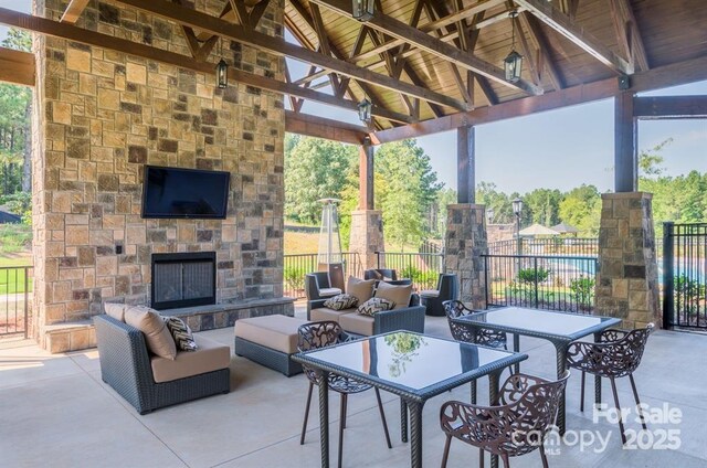 4354 Persimmon Rd, Lancaster, SC 29720 - view of patio with an outdoor living space with a fireplace, a gazebo, and fence