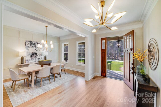 4354 Persimmon Rd, Lancaster, SC 29720 - dining area with crown molding, a wealth of natural light, and an inviting chandelier