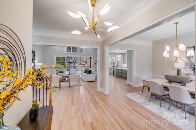 4354 Persimmon Rd, Lancaster, SC 29720 - dining room with light wood-style flooring, baseboards, an inviting chandelier, and crown molding