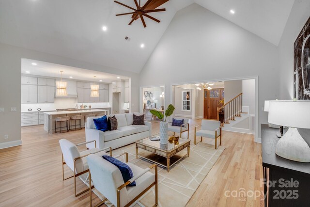 4354 Persimmon Rd, Lancaster, SC 29720 - living area with light wood-type flooring, high vaulted ceiling, recessed lighting, and stairs