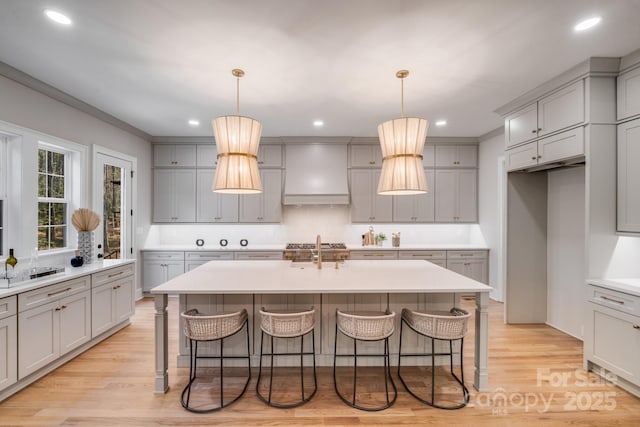 4354 Persimmon Rd, Lancaster, SC 29720 - kitchen featuring custom exhaust hood, a kitchen breakfast bar, and gray cabinets