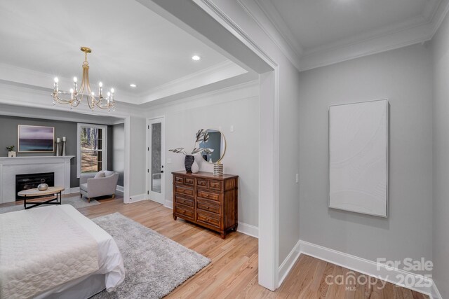 4354 Persimmon Rd, Lancaster, SC 29720 - bedroom featuring light wood finished floors, a notable chandelier, ornamental molding, and baseboards