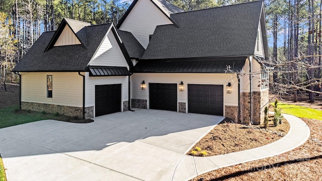4354 Persimmon Rd, Lancaster, SC 29720 - view of front of house featuring roof with shingles, a garage, stone siding, and driveway