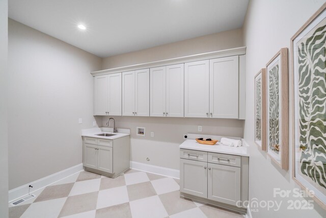 4354 Persimmon Rd, Lancaster, SC 29720 - clothes washing area featuring hookup for a washing machine, light floors, visible vents, a sink, and cabinet space