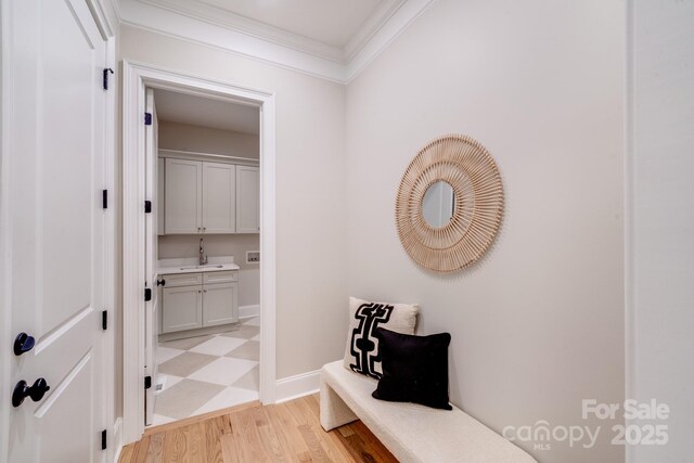 4354 Persimmon Rd, Lancaster, SC 29720 - hall with crown molding, baseboards, light wood-style floors, and a sink