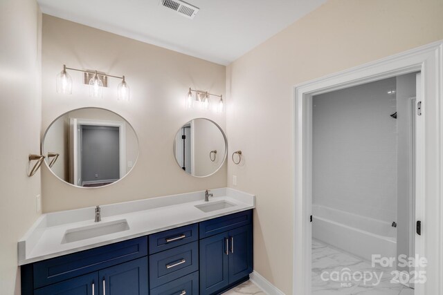 4354 Persimmon Rd, Lancaster, SC 29720 - bathroom featuring double vanity, visible vents, marble finish floor, and a sink