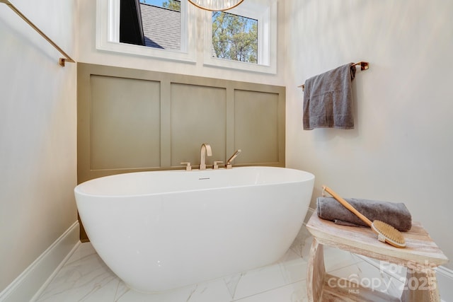 4354 Persimmon Rd, Lancaster, SC 29720 - bathroom with a freestanding tub, marble finish floor, and baseboards