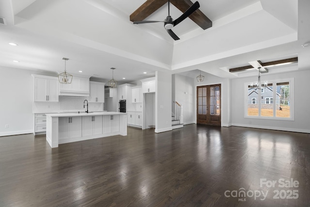 3732 Whitney Dr NE, Hickory, NC 28601 - unfurnished living room with a chandelier, recessed lighting, beamed ceiling, ceiling fan, and dark wood-style floors