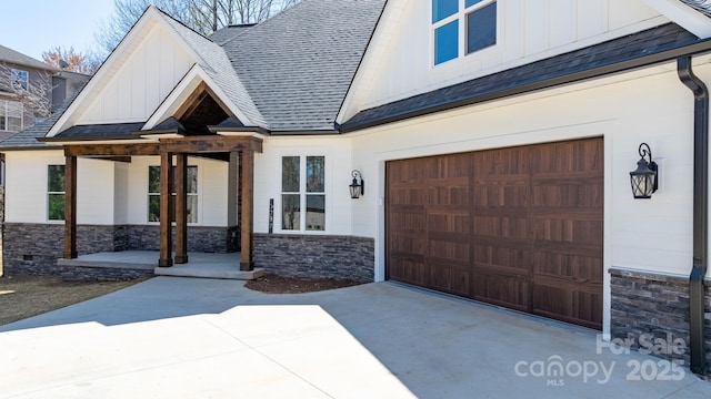 3732 Whitney Dr NE, Hickory, NC 28601 - view of front facade with board and batten siding, stone siding, driveway, and a shingled roof