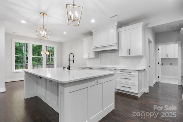 3732 Whitney Dr NE, Hickory, NC 28601 - kitchen with a chandelier, decorative backsplash, dark wood finished floors, light countertops, and recessed lighting