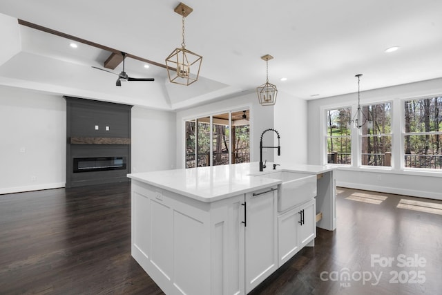 3732 Whitney Dr NE, Hickory, NC 28601 - kitchen featuring dark wood-style floors, recessed lighting, plenty of natural light, and a large fireplace