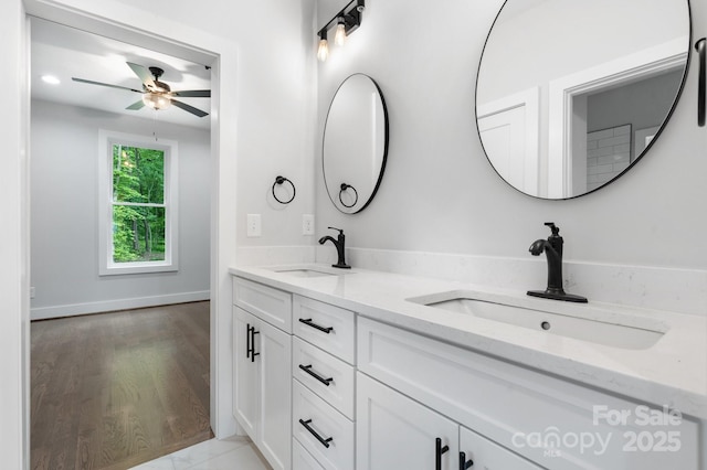 3732 Whitney Dr NE, Hickory, NC 28601 - bathroom with double vanity, a ceiling fan, and wood finished floors
