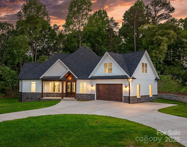3732 Whitney Dr NE, Hickory, NC 28601 - modern farmhouse with stone siding, french doors, concrete driveway, and board and batten siding