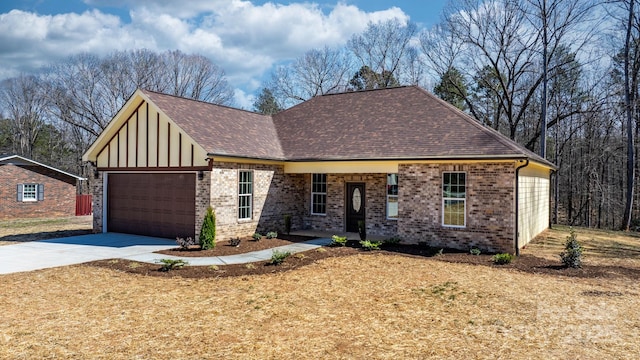 view of front facade featuring driveway, brick siding, roof with shingles, and an attached garage