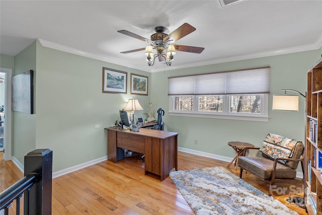 office featuring light wood-style flooring, a ceiling fan, baseboards, and ornamental molding