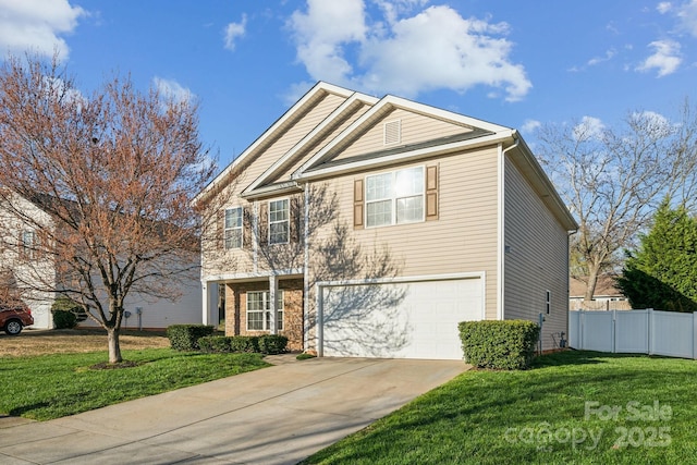 view of front facade featuring a front yard, fence, a garage, and driveway