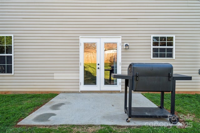 entrance to property with french doors and a patio area