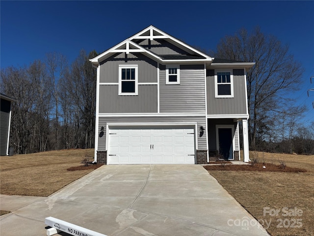 view of front of house with a garage, board and batten siding, and concrete driveway