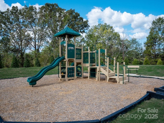 community jungle gym featuring a yard