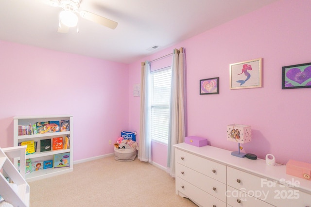 bedroom with visible vents, light colored carpet, a ceiling fan, and baseboards