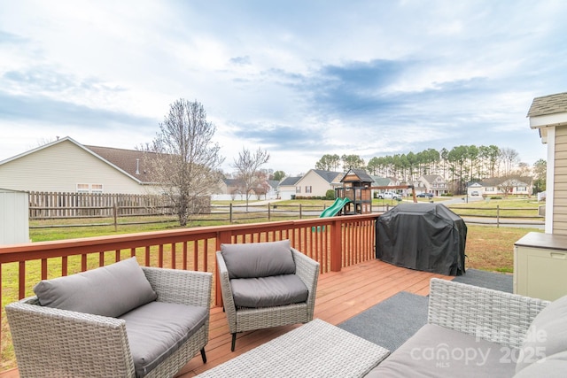 deck with an outdoor living space, a fenced backyard, a playground, a residential view, and a grill