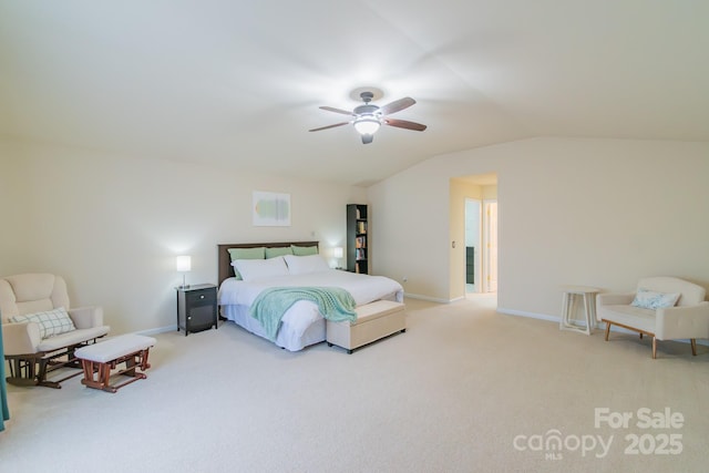 bedroom featuring vaulted ceiling, baseboards, and light carpet