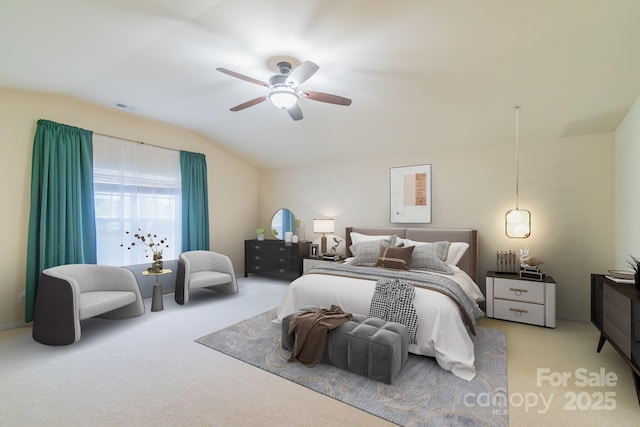 bedroom with visible vents, carpet floors, a ceiling fan, and vaulted ceiling