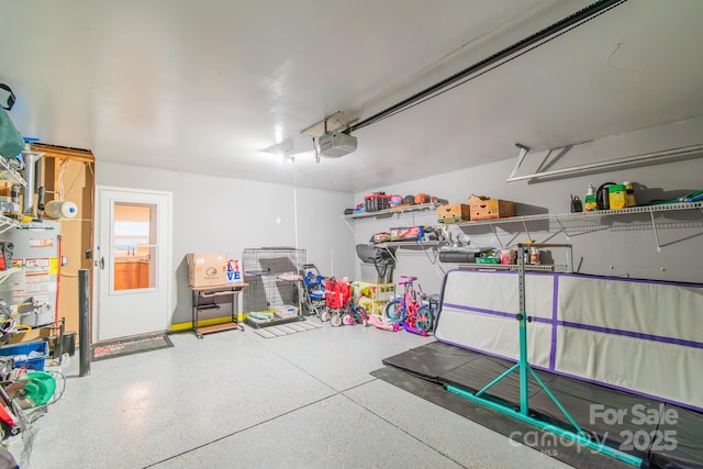 garage with water heater and a garage door opener