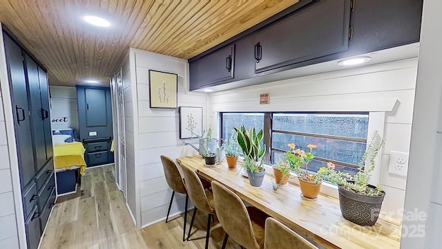 kitchen featuring wooden ceiling and light wood-type flooring