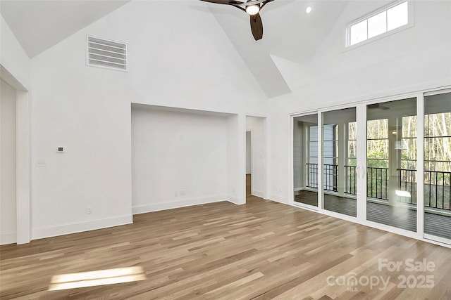 spare room featuring visible vents, baseboards, a ceiling fan, and light wood finished floors