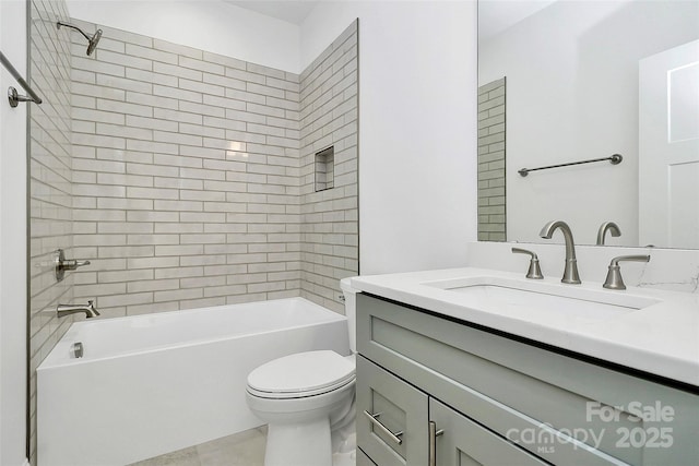 bathroom featuring vanity, toilet, and bathing tub / shower combination