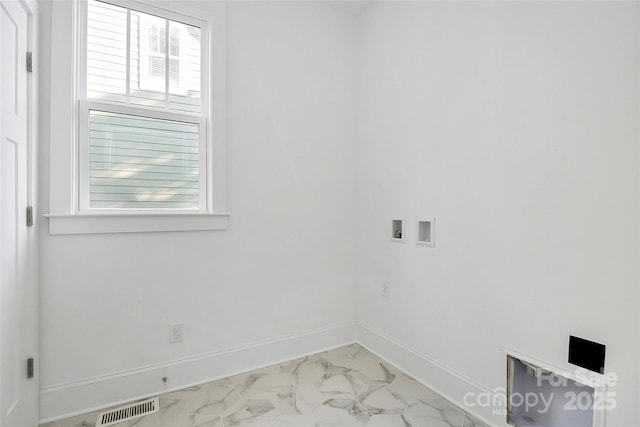 spare room featuring baseboards, visible vents, and marble finish floor