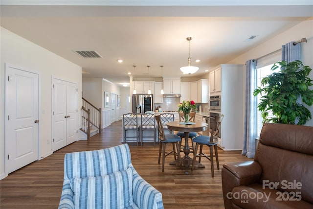 interior space with recessed lighting, visible vents, dark wood-style floors, and stairs