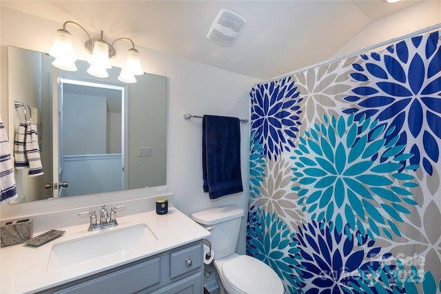 bathroom with visible vents, toilet, a shower with shower curtain, vanity, and vaulted ceiling